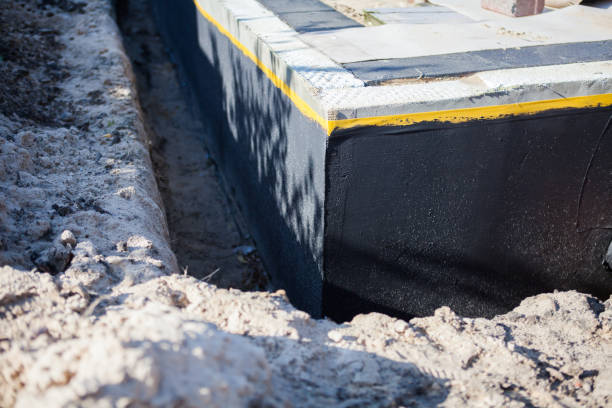Professional Exterior Waterproofing technician working in Highland, IL